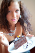 Photo: Beautiful girl eating cake. Shallow depth of field Beautiful girl eating cake. Shallow depth of field