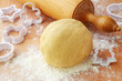 Rolling pin and shortcrust pastry on table Rolling pin and shortcrust pastry on table