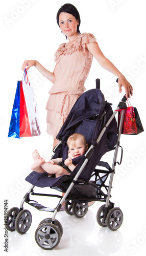 Photo: Young mother with baby in perambulator Young mother with baby in perambulator