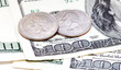 coins on dollars background