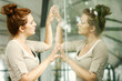 Glass reflection of a woman