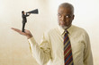 Miniature businessman speaking with bull horn to giant businessman