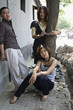 Chinese friends standing on sidewalk