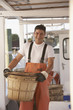 Hispanic fisherman carrying basket