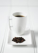Coffee and coffee beans on plate