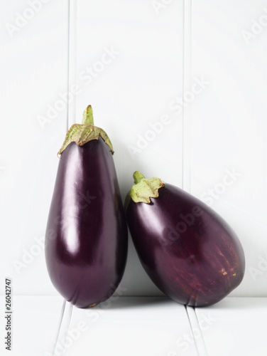 Photo: Close up of eggplants leaning against wall Close up of eggplants leaning against wall