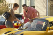 Hispanic couple car shopping