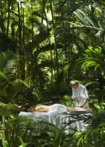 Photo: Pacific Islander woman receiving massage in jungle Pacific Islander woman receiving massage in jungle