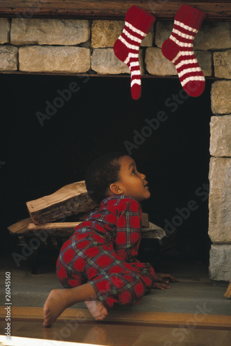 Photo: Young African boy looking up chimney Young African boy looking up chimney