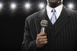 African American man holding microphone