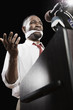 African American man at podium with gag in mouth