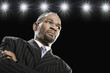 African American man with arms crossed looking serious