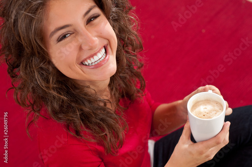 Photo: simpatic girl drinking coffee simpatic girl drinking coffee