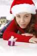 Beautiful young woman wearing santa hat