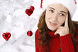 Beautiful young woman next to christmas tree
