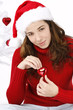 Beautiful young woman wearing santa hat