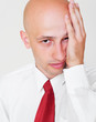 weary businessman over grey background weary businessman over grey background