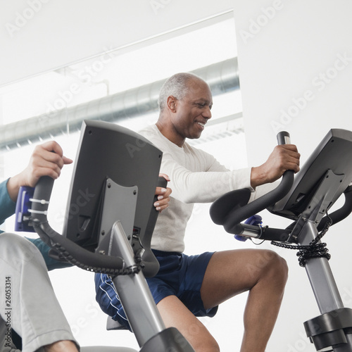 Photo: African man exercise in health club African man exercise in health club