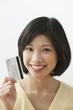 Filipino woman holding credit card