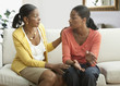 Photo: Mother and daughter talking on sofa Mother and daughter talking on sofa