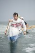 Outrigger canoeing team on water