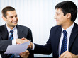 Photos : Businesspeople, or businessman and client, with document