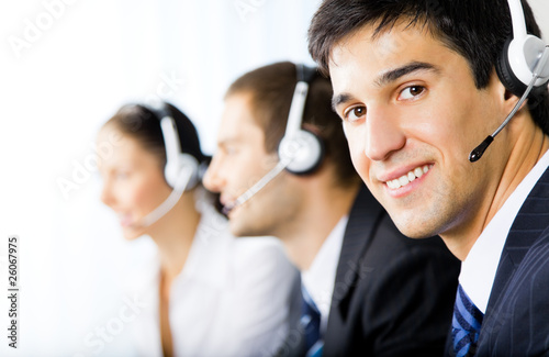 Photo: Three support phone operators at workplace Three support phone operators at workplace