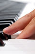Close-up of a electronic piano keyboard on white