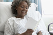 African hospital patient reading greeting card