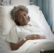 African hospital patient frowning