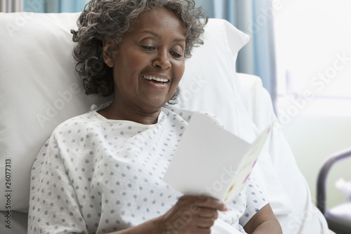 Photo: African hospital patient reading greeting card African hospital patient reading greeting card