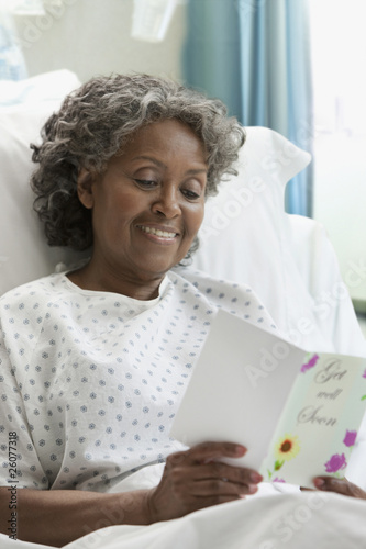 Photo: African hospital patient reading greeting card African hospital patient reading greeting card