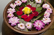 Flowers floating on water in bowl