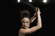 Mixed race woman performing martial arts with sword