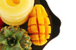 tropical fruits served on black tropical fruits served on black