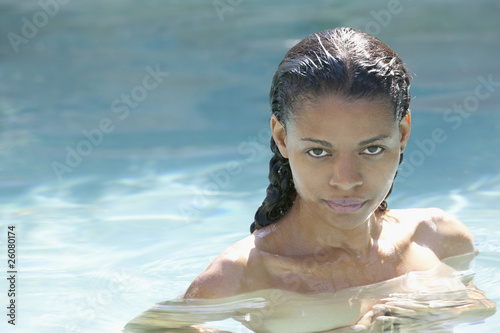 Photo: Nude mixed race woman in swimming pool Nude mixed race woman in swimming pool