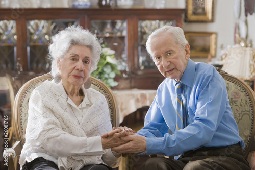 Photo: Senior Hispanic couple holding hands Senior Hispanic couple holding hands