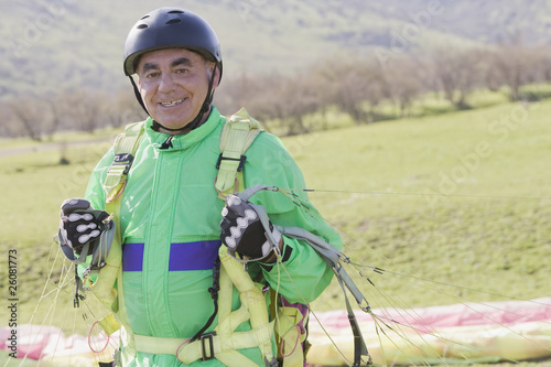 Photo: Senior Hispanic man skydiving Senior Hispanic man skydiving