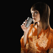 Mixed race woman drinking
