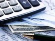 Financial concept. Calculator and pen.