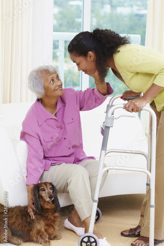 Photo: African American woman helping senior mother African American woman helping senior mother