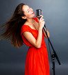Famous female jazz singer singing in retro mic