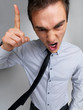 Frustrated young business man warning you