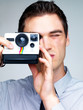 Professional young male photographer shooting pictures