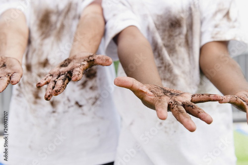 Photo: Boys displaying their messy hands Boys displaying their messy hands