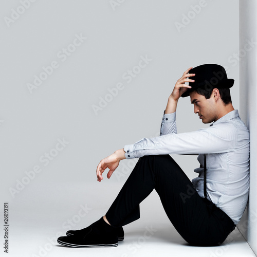 Photo: Handsome young man in thoughtful mood Handsome young man in thoughtful mood