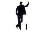 Rear view of young man standing with his briefcase