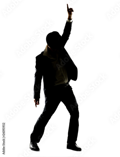 Photo: Silhouette image of a young male superstar dancing Silhouette image of a young male superstar dancing