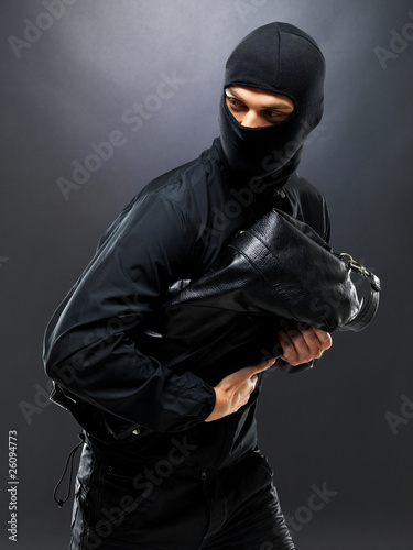 Photo: Sneaky thief making off with some loot Sneaky thief making off with some loot