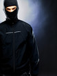 Evil male criminal wearing balaclava - Copyspace